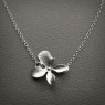 Delicate matte silver orchid necklace by SimplyBrieDesigns on Etsy